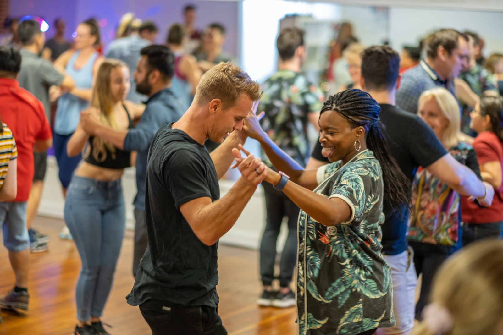 Two students laughing together while dancing at Dance Culture